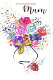 This Mother's Day card presents a joyful, painterly bouquet that seems to sway gently, as though caught in a soft breeze drifting up from the Thames at Waterloo. The arrangement is rendered in fluid watercolour washes, where saturated purples, playful pinks, and rich reds mingle with cooler blues and soft lavender, creating a sense of harmony and movement rather than rigid formality. Each blossom appears loosely defined, its petals shaped by sweeping strokes and feathered edges, giving the impression of flowers that are alive and still unfolding. Fine, shimmering touches of gold highlight selected contours - a petal here, a leaf there - evoking the glint of light on fresh dew, while also lending a touch of elegance that never feels heavy-handed. The bouquet gathers naturally into a vase whose rounded form is painted in translucent layers, as if seen through water or glass, and a stylised golden bow at the base suggests the careful finishing touches a florist adds before a bouquet leaves the shop. Around the central design, scattered flecks and droplets of colour float like petals released in celebration, and subtle heart shapes echo the tender intention behind the card. The white background keeps everything fresh and open, allowing the colours to glow as if illuminated by daylight along nearby The Cut or Lower Marsh. Emotionally, the image conveys warmth, gratitude, and a gentle joy - the feeling of arriving at a mother's door with flowers chosen just for her, ready to say thank you for every quiet act of love, every story shared, and every moment of unwavering support.